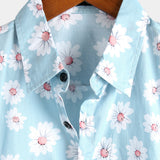 Chemise d'Été pour Homme à Manches Courtes de Style Hawaïen en Couleur Bleue avec des Fleurs de Marguerite